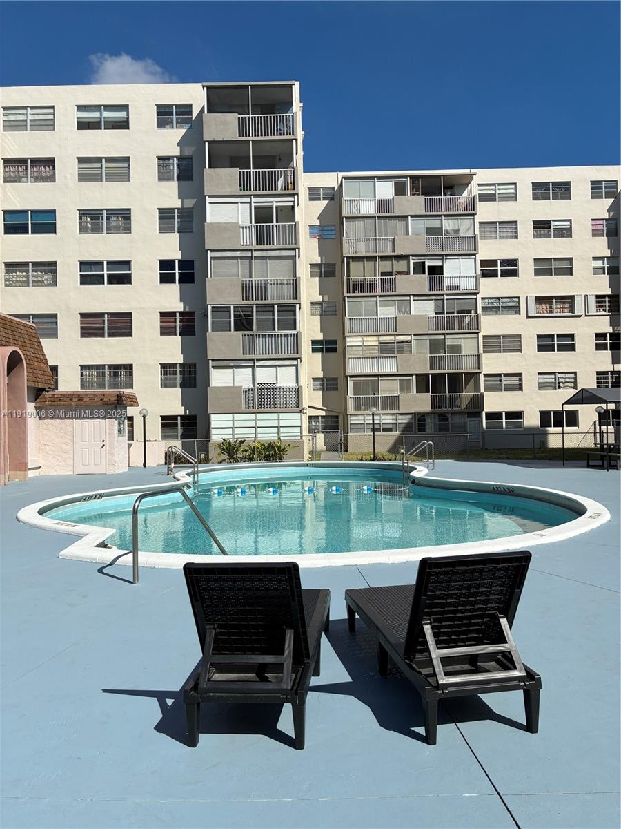 16400 Northeast 17th Avenue, Unit 3042 North Miami Beach, FL 33162 - Photo 13 of 17 a view of a patio with a table and chairs