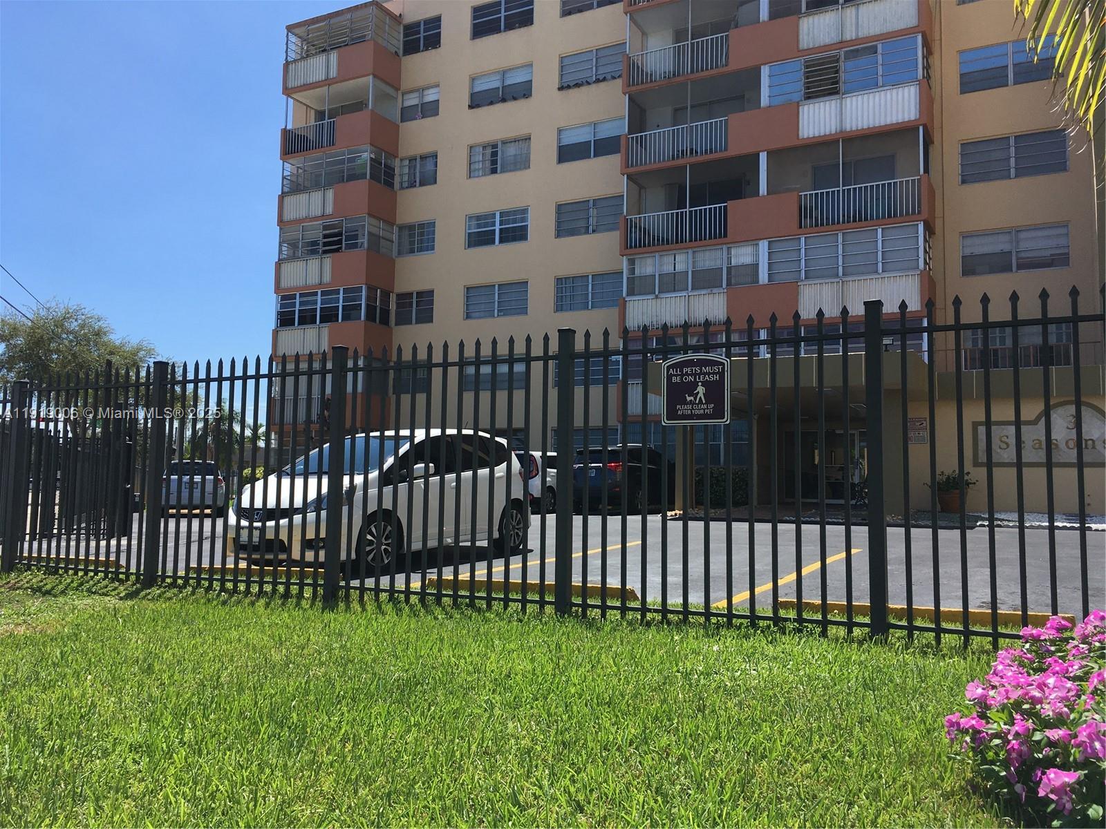 16400 Northeast 17th Avenue, Unit 3042 North Miami Beach, FL 33162 - Photo 15 of 17 a view of a building with a garden