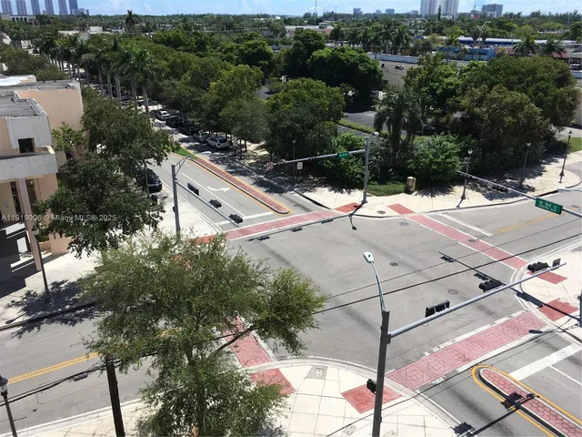 a aerial view of a house with a yard