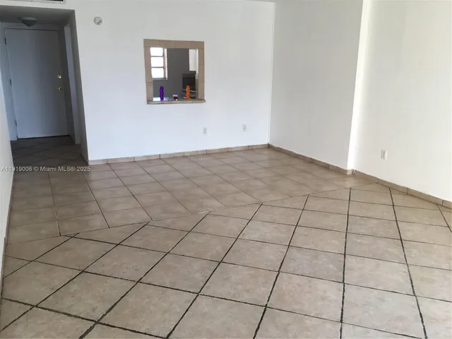 a view of a livingroom and window