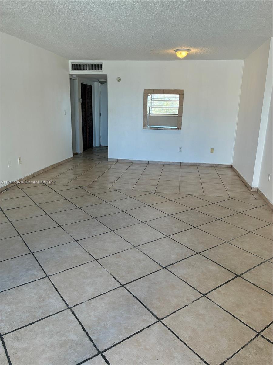 16400 Northeast 17th Avenue, Unit 3042 North Miami Beach, FL 33162 - Photo 4 of 17 a view of an empty room