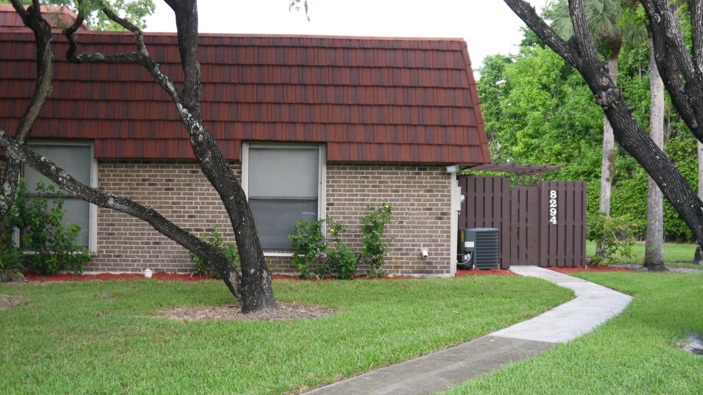 a house view with a backyard space