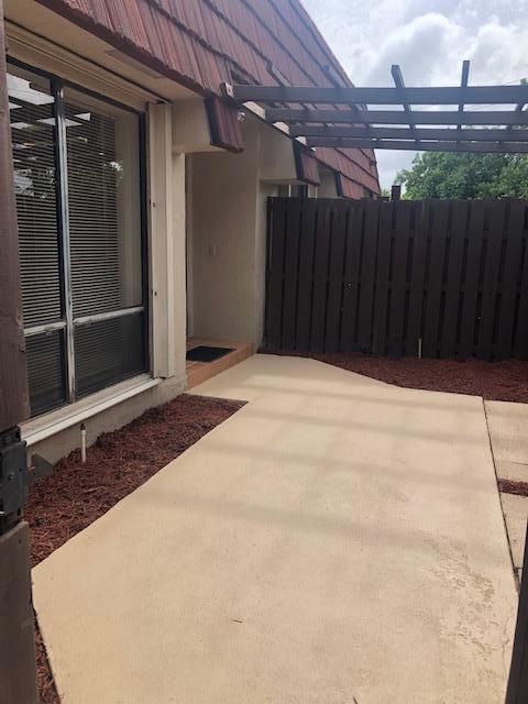 8294 Boca Rio Drive Boca Raton, FL 33433 - Photo 15 of 18 a view of backyard with hardwood