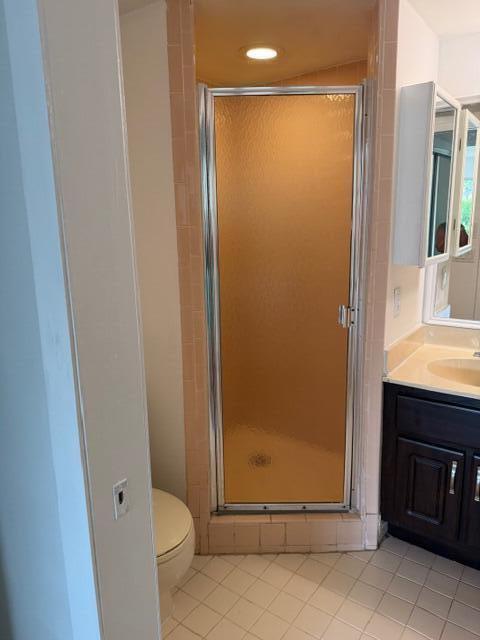 8294 Boca Rio Drive Boca Raton, FL 33433 - Photo 9 of 18 a bathroom with a glass shower door
