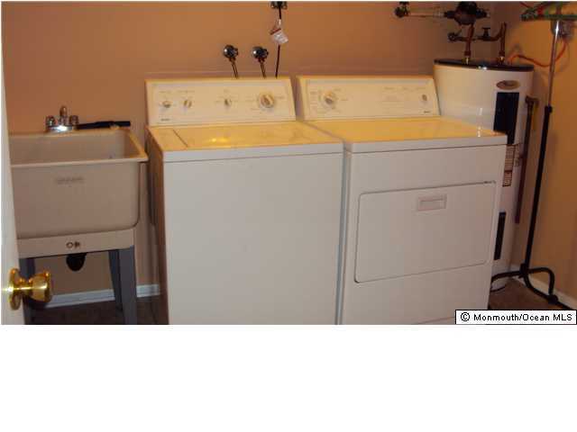 3A Spring Street, Unit B Whiting, NJ 08759 - Photo 17 of 17 a bathroom with a sink and a washing machine