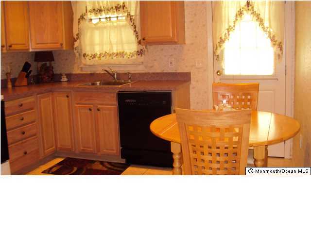 3A Spring Street, Unit B Whiting, NJ 08759 - Photo 8 of 17 a bathroom with a sink a mirror and a bathtub