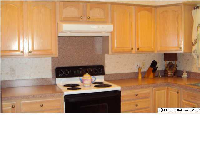 3A Spring Street, Unit B Whiting, NJ 08759 - Photo 9 of 17 a kitchen with a stove and a window