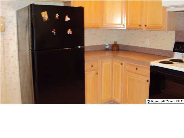 3A Spring Street, Unit B Whiting, NJ 08759 - Photo 10 of 17 a kitchen with a sink a refrigerator and window