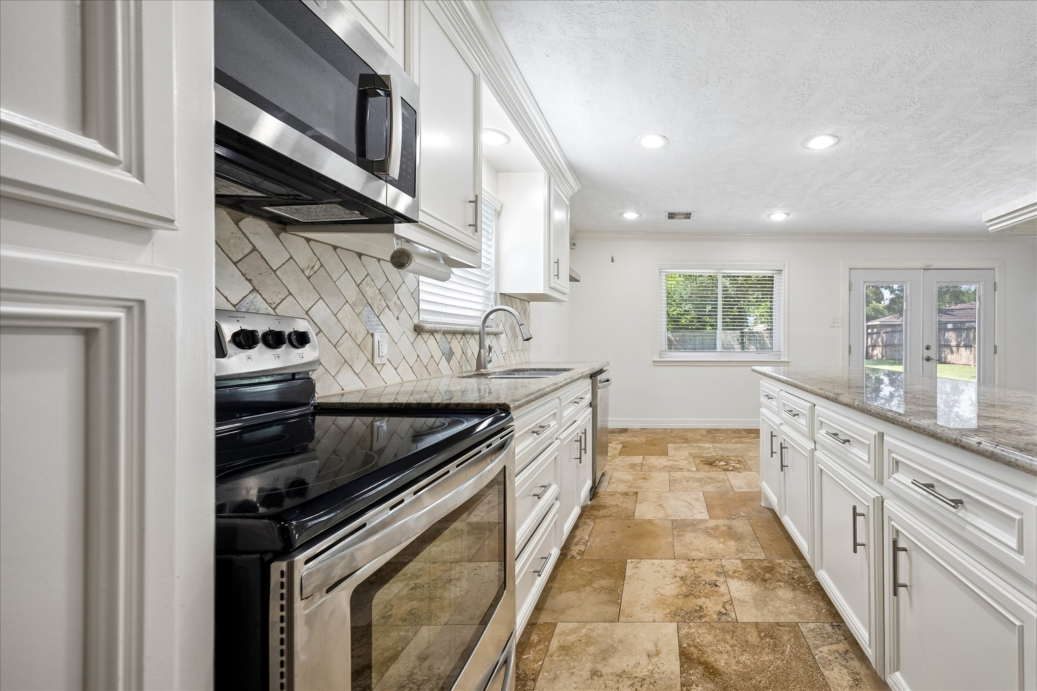 5019 Kinglet Street Houston, TX 77035 - Photo 9 of 24 Closer view of kitchen amenities with upgraded hardware & plumbing fixtures.