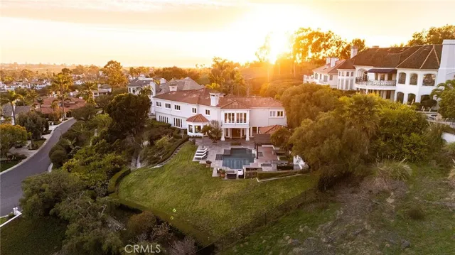 a aerial view of a house with a garden and trees