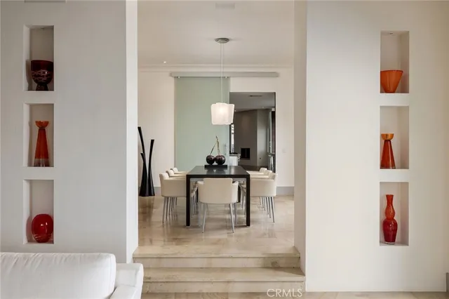 a dining room with a table and chairs