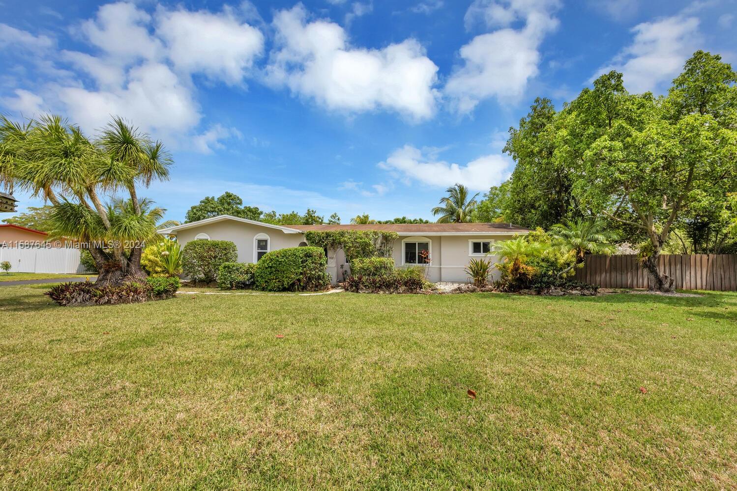 18565 Southwest 295th Terrace Homestead, FL 33030 - Photo 1 of 42 a front view of a house with garden
