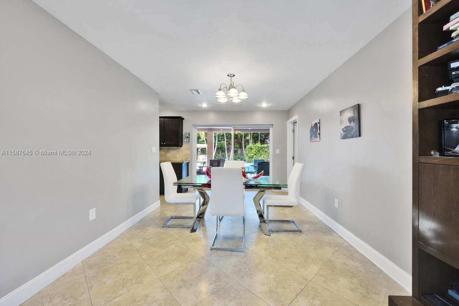 18565 Southwest 295th Terrace Homestead, FL 33030 - Photo 14 of 42 a dining room with furniture and window