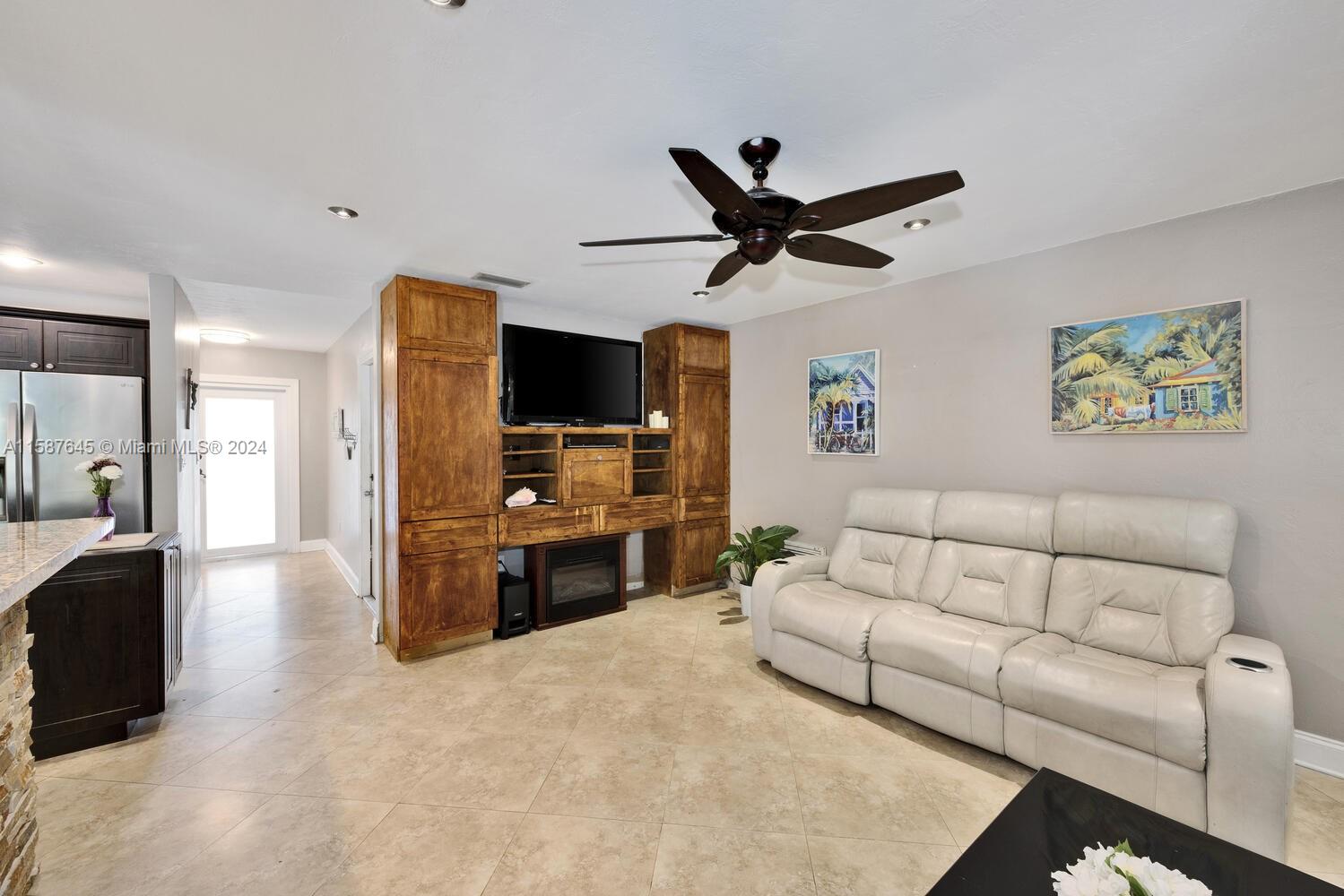 18565 Southwest 295th Terrace Homestead, FL 33030 - Photo 19 of 42 a living room with furniture and a flat screen tv