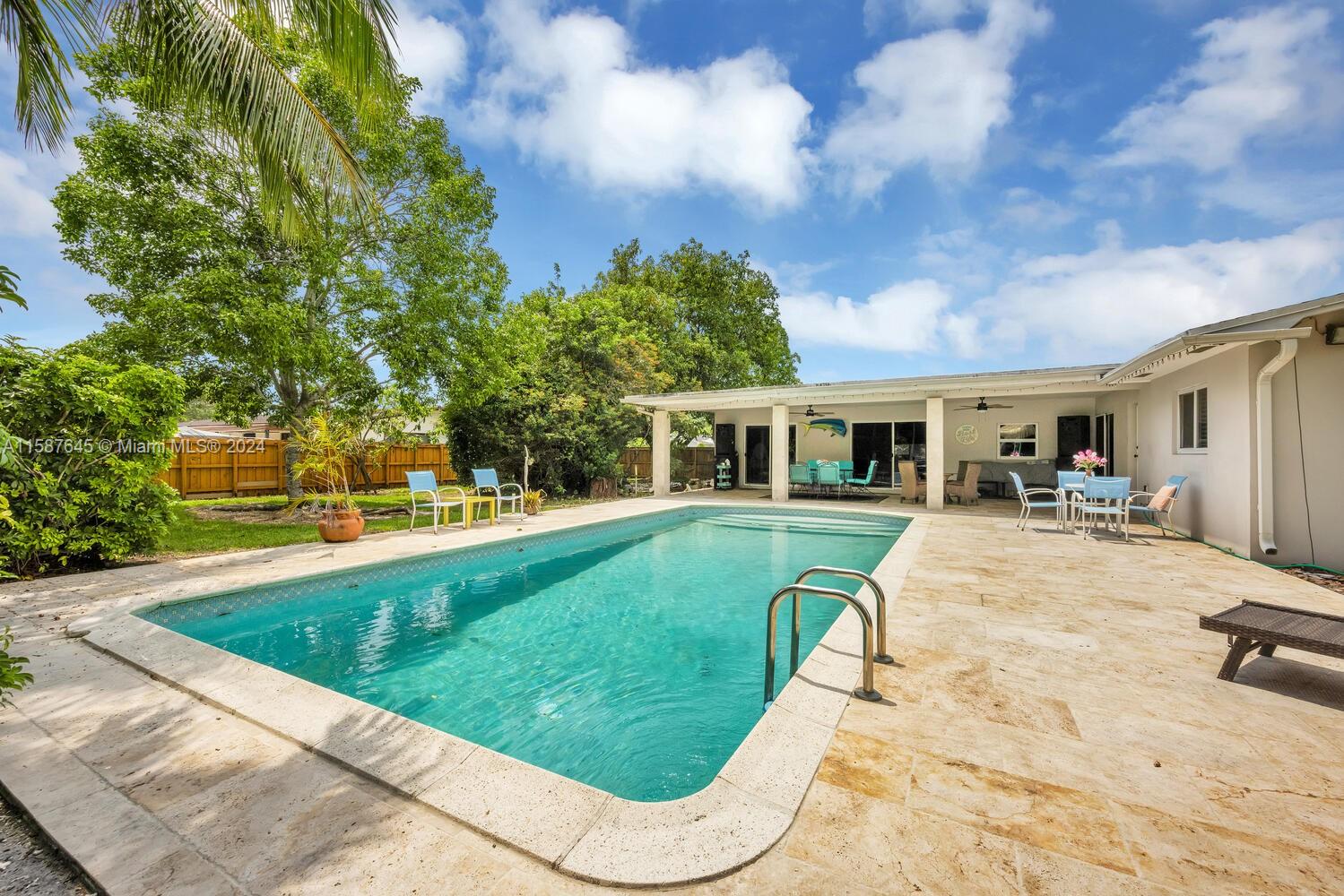18565 Southwest 295th Terrace Homestead, FL 33030 - Photo 40 of 42 a view of a house with a swimming pool