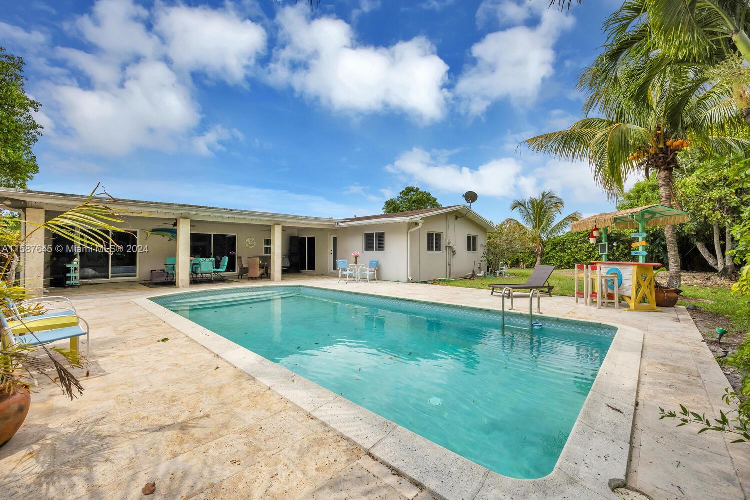 18565 Southwest 295th Terrace Homestead, FL 33030 - Photo 41 of 42 a front view of house with yard and swimming pool
