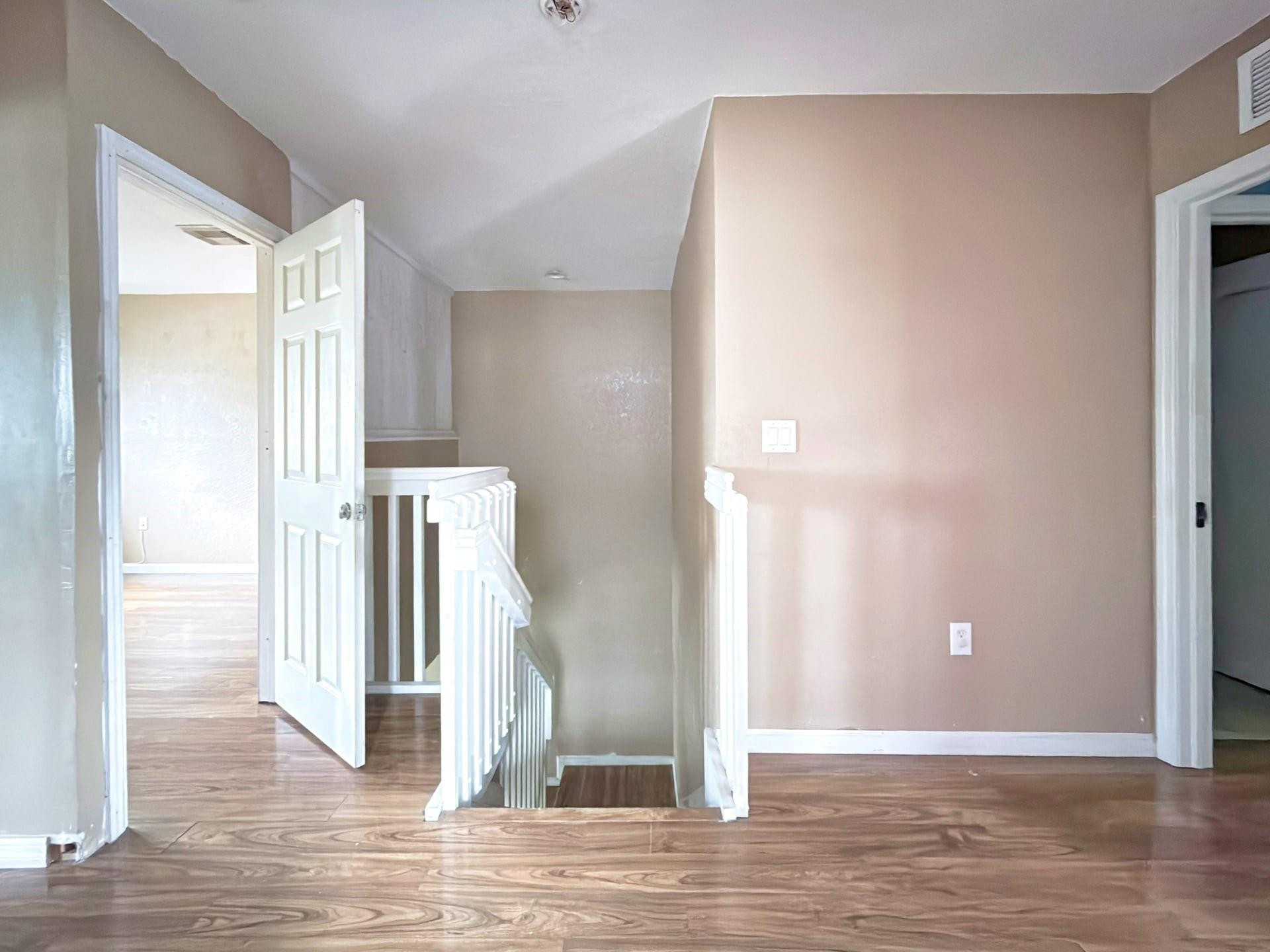 14218 Southwest 272nd Street, Unit 1 Homestead, FL 33032 - Photo 13 of 24 a view of a room with wooden floor