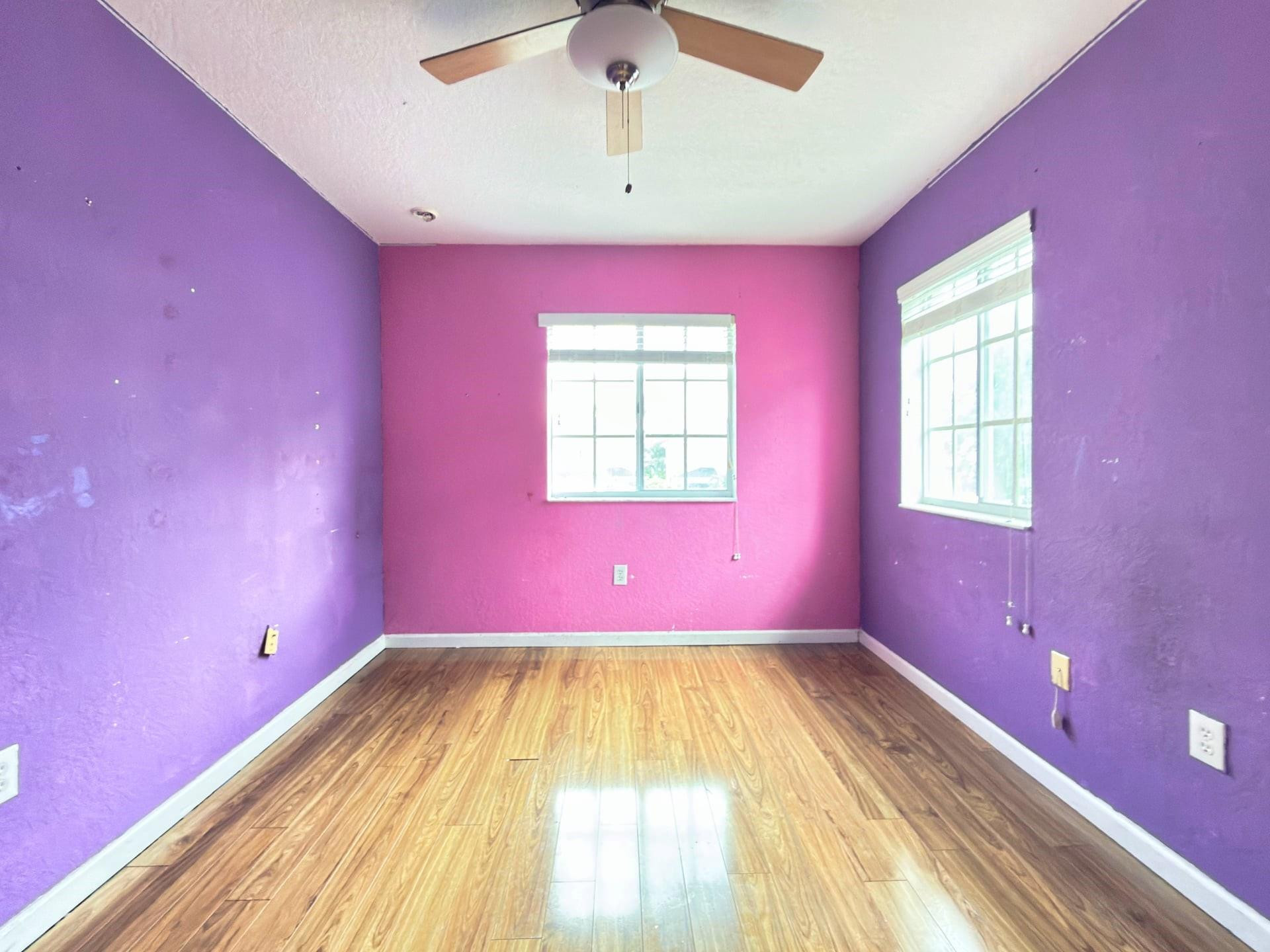 14218 Southwest 272nd Street, Unit 1 Homestead, FL 33032 - Photo 14 of 24 a view of a room with window and a ceiling fan