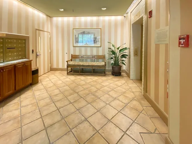 a view of an entryway with wooden floor and a window