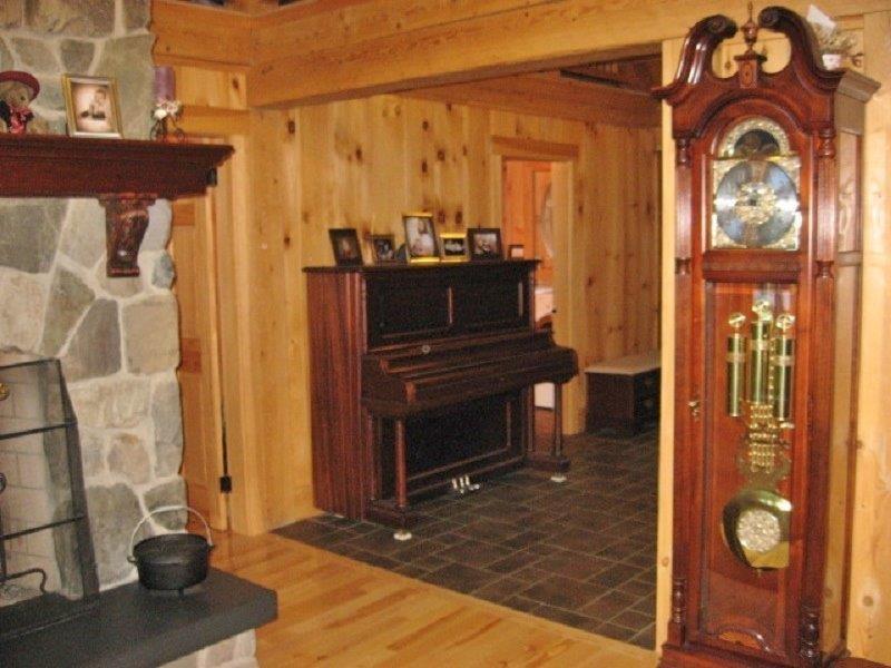 492 W Road Sangerville, ME 04479 - Photo 13 of 33 Stone fireplace wood and tile...