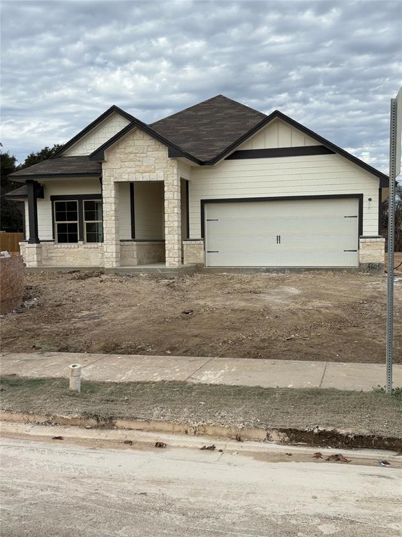 5605 Beckon Falls Waco, TX 76708 - Photo 1 of 1 Single story home featuring stone siding, driveway, a garage, and covered porch