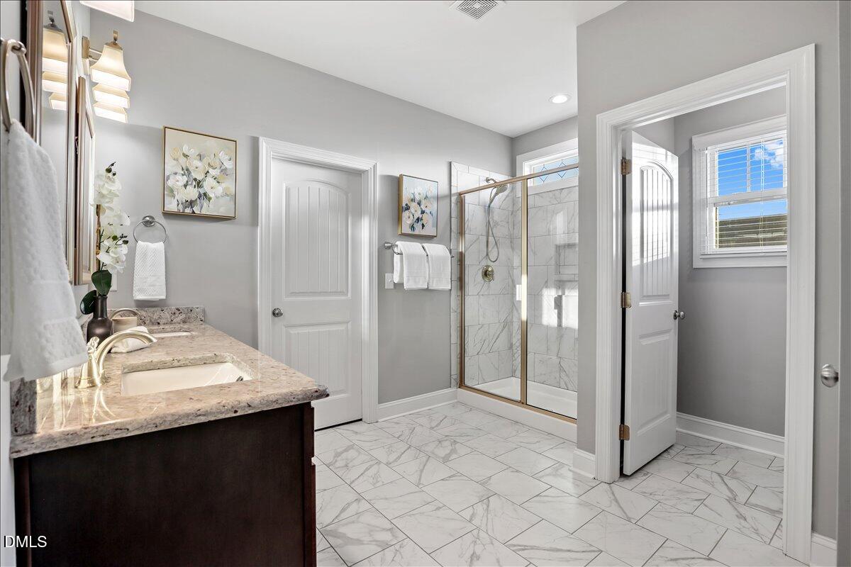 88 Heath Road Lillington, NC 27546 - Photo 12 of 54 a bathroom with a sink and a mirror