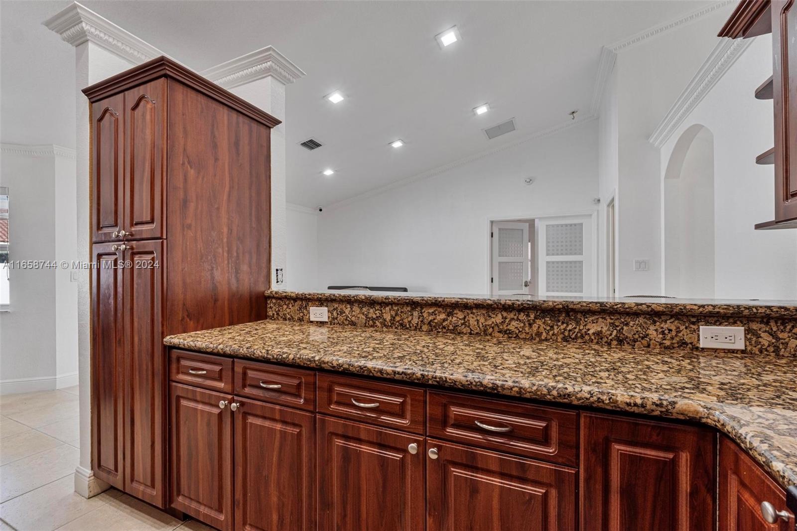 3209 Southwest 142nd Place Miami, FL 33175 - Photo 13 of 42 a view of a kitchen with granite countertop cabinets