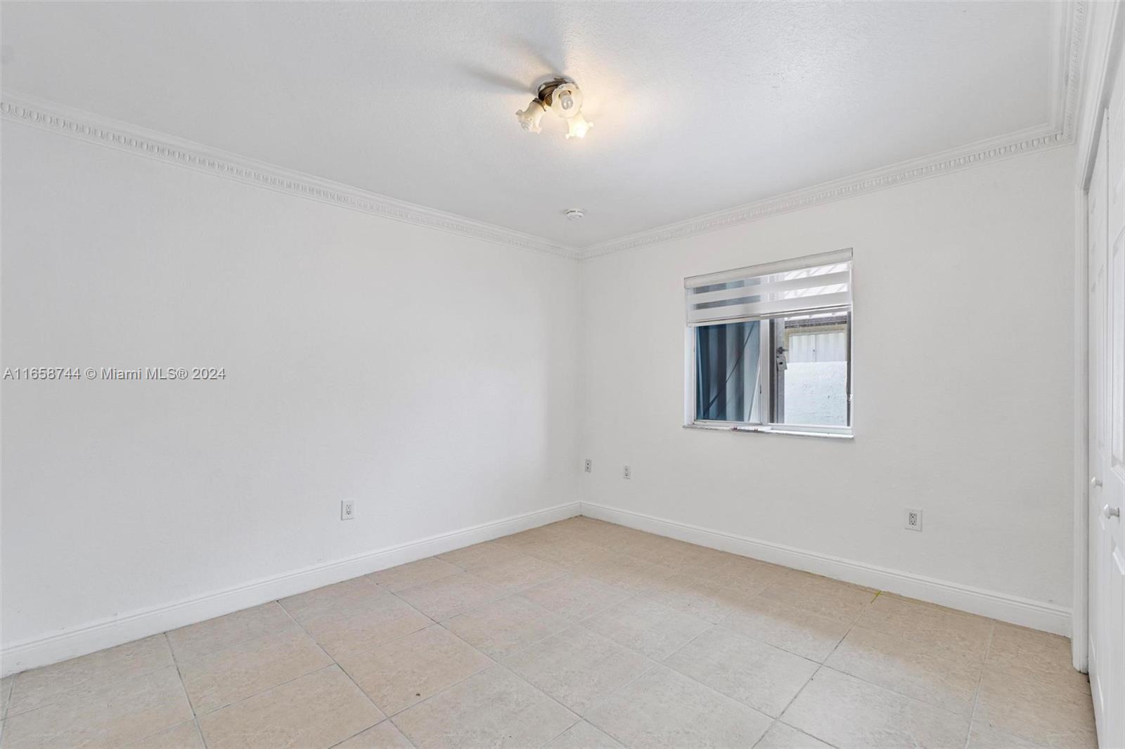 3209 Southwest 142nd Place Miami, FL 33175 - Photo 16 of 42 wooden floor in an empty room