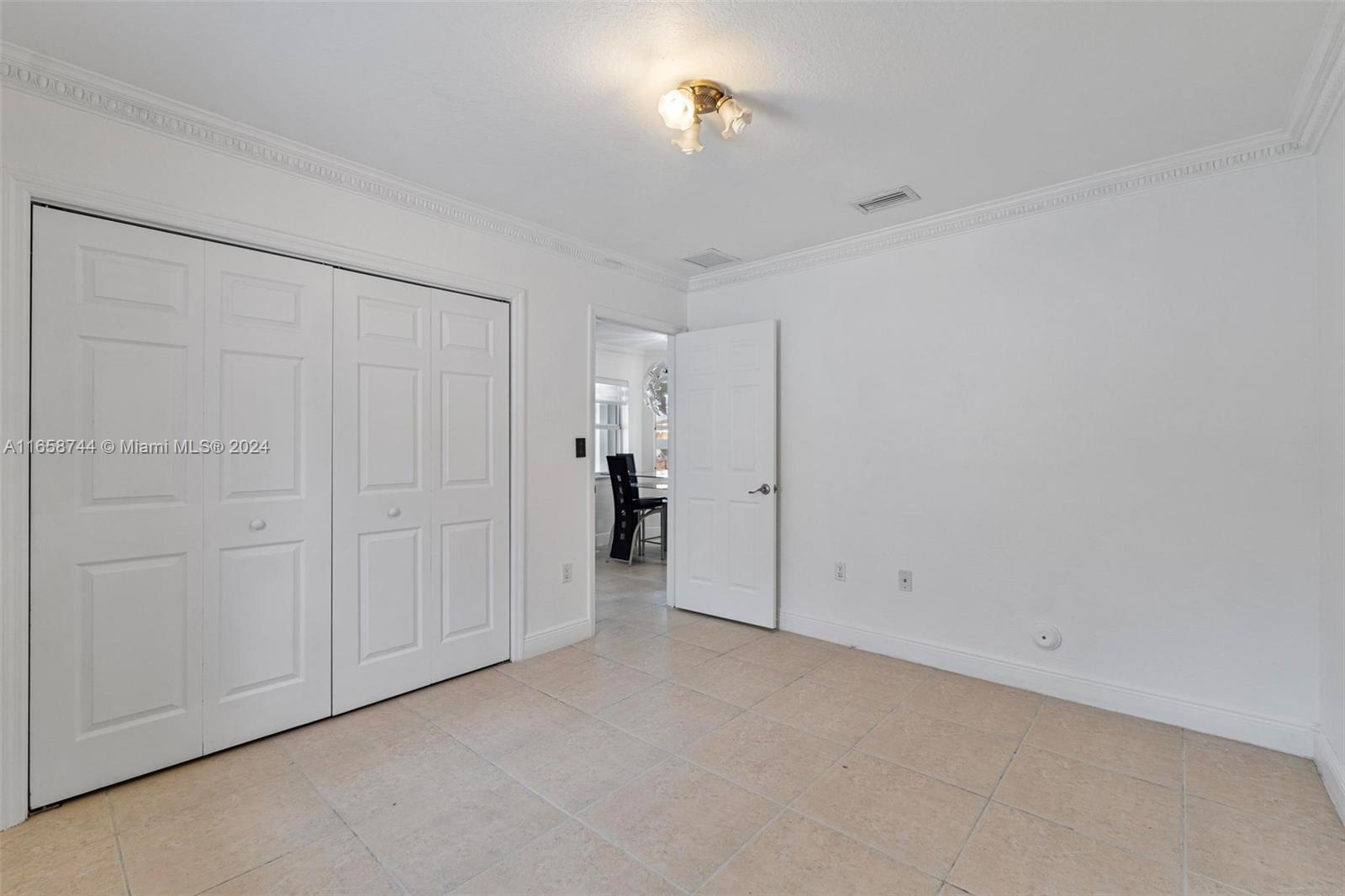 3209 Southwest 142nd Place Miami, FL 33175 - Photo 17 of 42 a view of an empty room