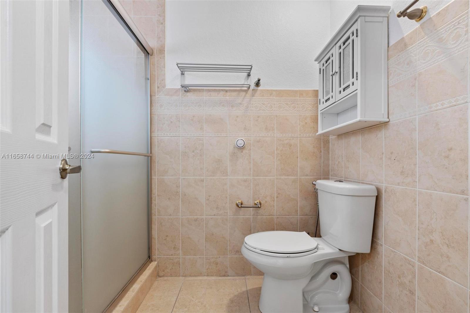 3209 Southwest 142nd Place Miami, FL 33175 - Photo 22 of 42 a bathroom with a toilet and a shower