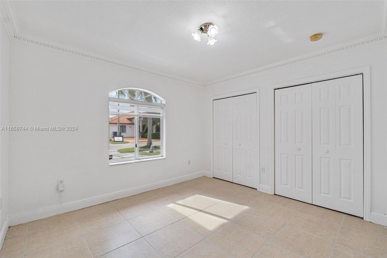 3209 Southwest 142nd Place Miami, FL 33175 - Photo 23 of 42 a view of an empty room with a window