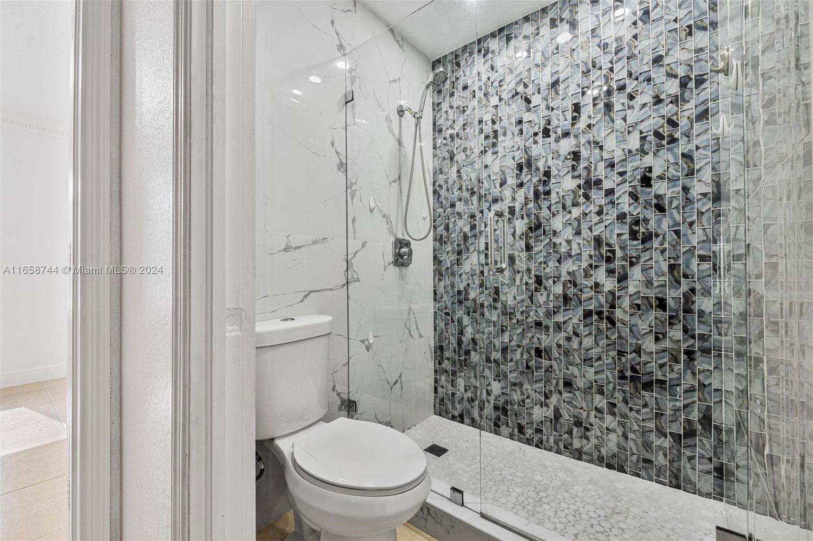 3209 Southwest 142nd Place Miami, FL 33175 - Photo 26 of 42 a bathroom with a toilet and a shower