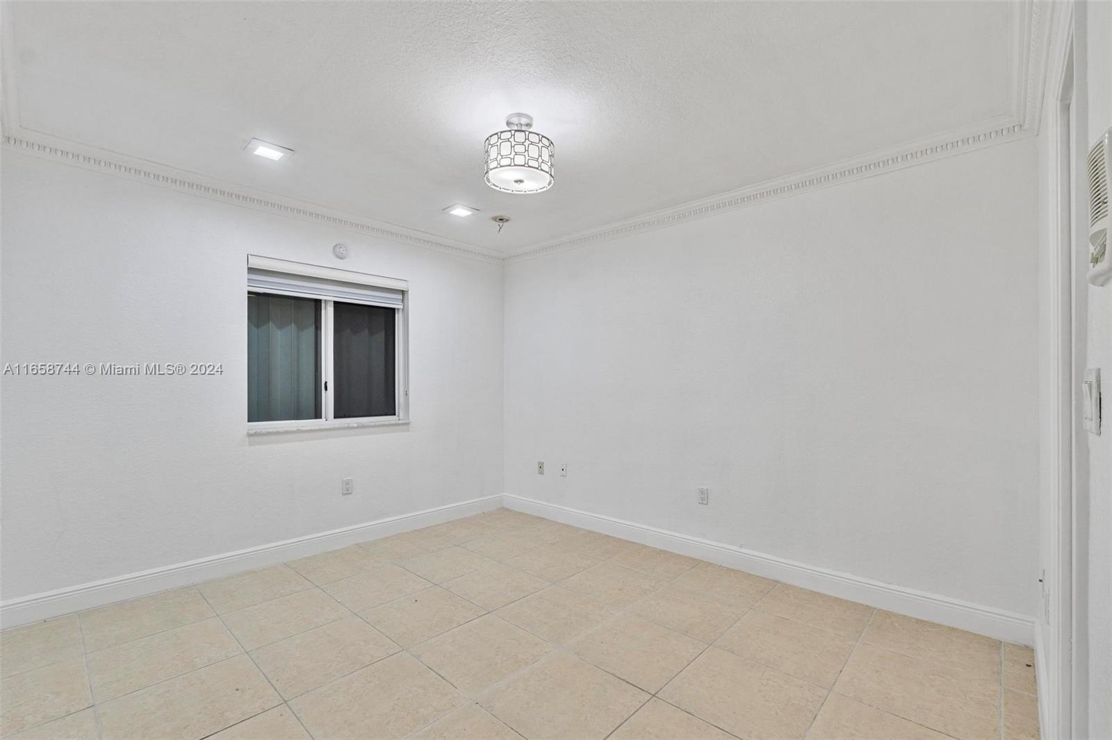 3209 Southwest 142nd Place Miami, FL 33175 - Photo 27 of 42 an empty room with a empty space and a window