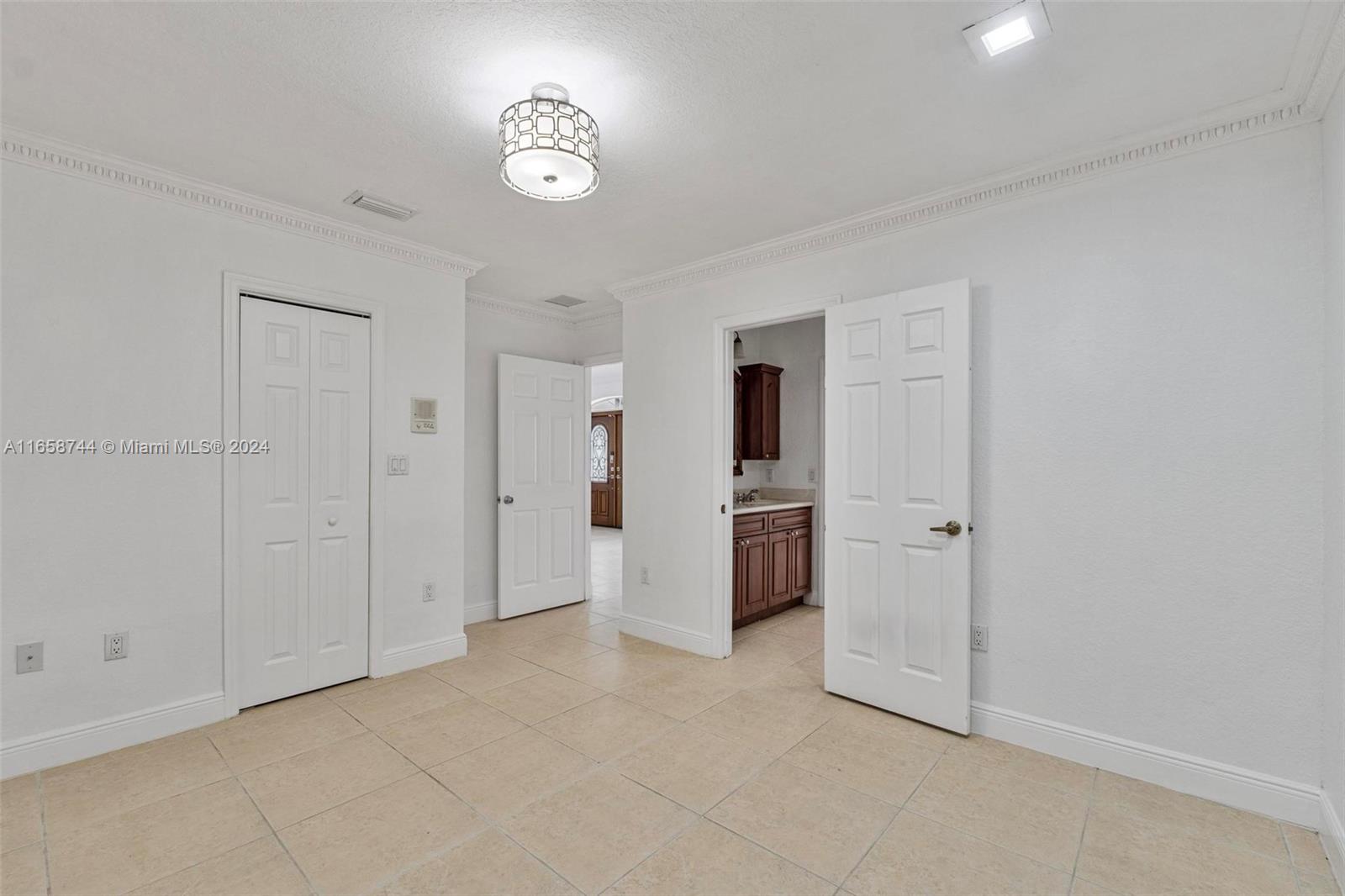 3209 Southwest 142nd Place Miami, FL 33175 - Photo 28 of 42 a view of an empty room with a window