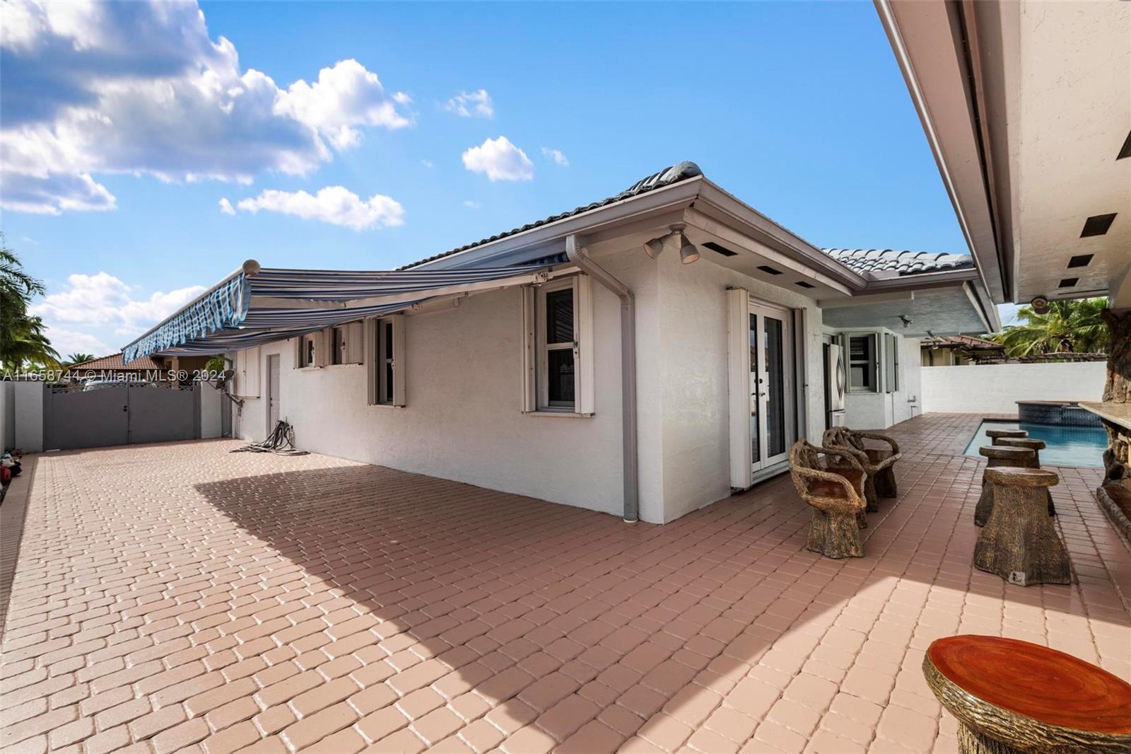 3209 Southwest 142nd Place Miami, FL 33175 - Photo 35 of 42 a view of a house with a patio