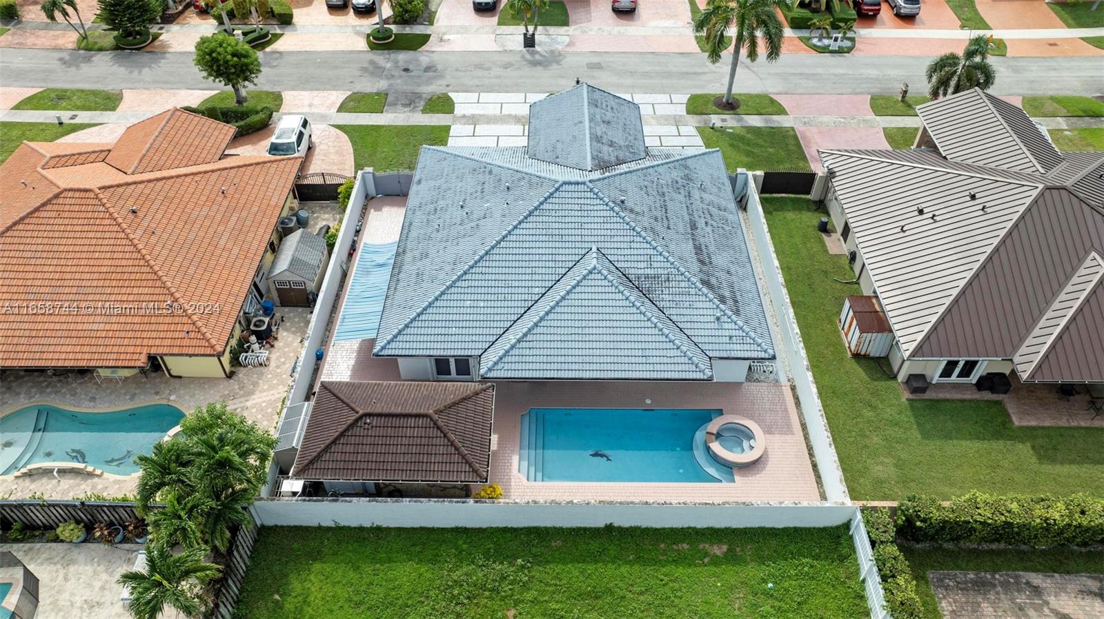 3209 Southwest 142nd Place Miami, FL 33175 - Photo 41 of 42 an aerial view of a house with a garden and swimming pool