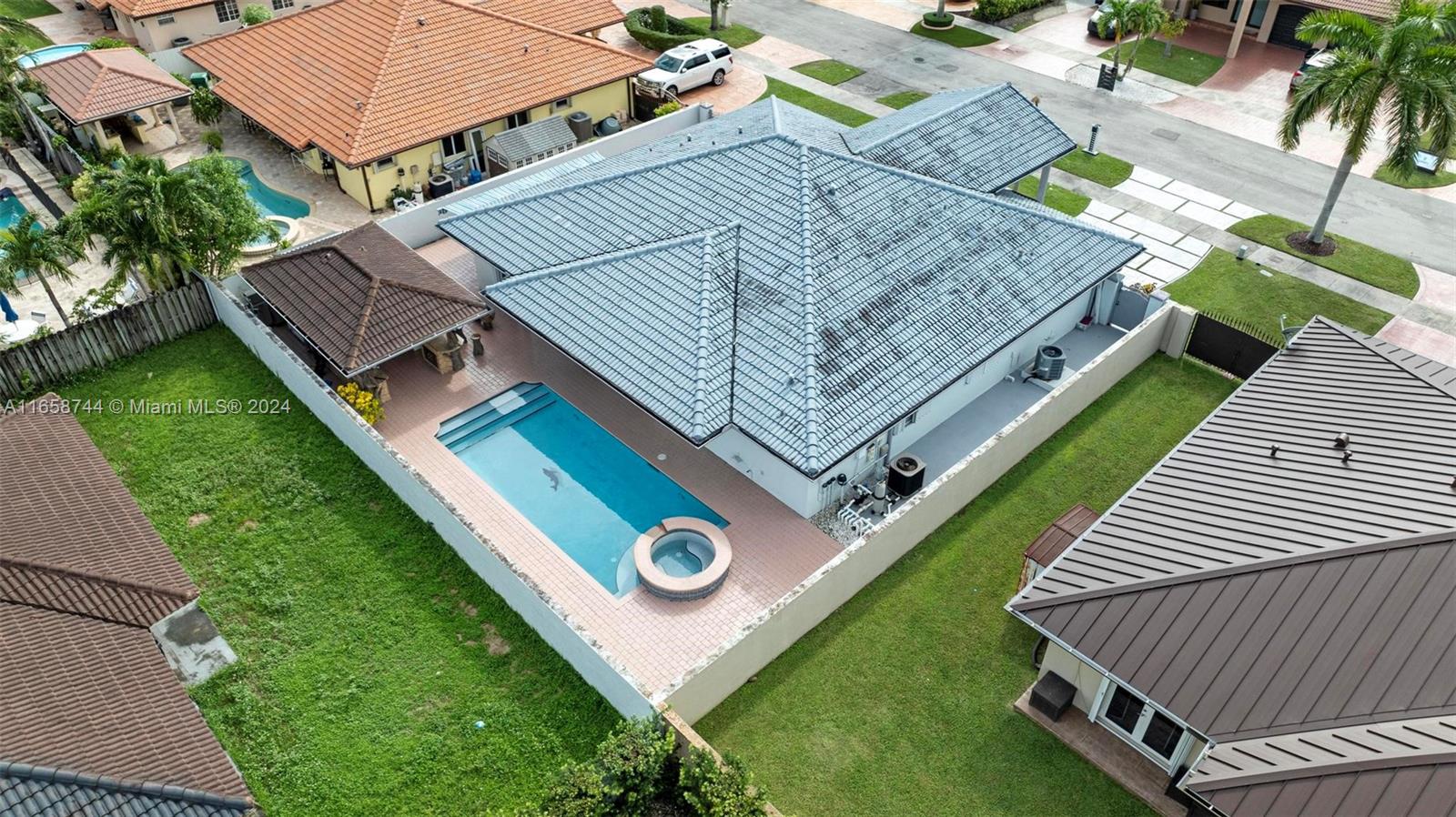 3209 Southwest 142nd Place Miami, FL 33175 - Photo 42 of 42 an aerial view of a house with a yard