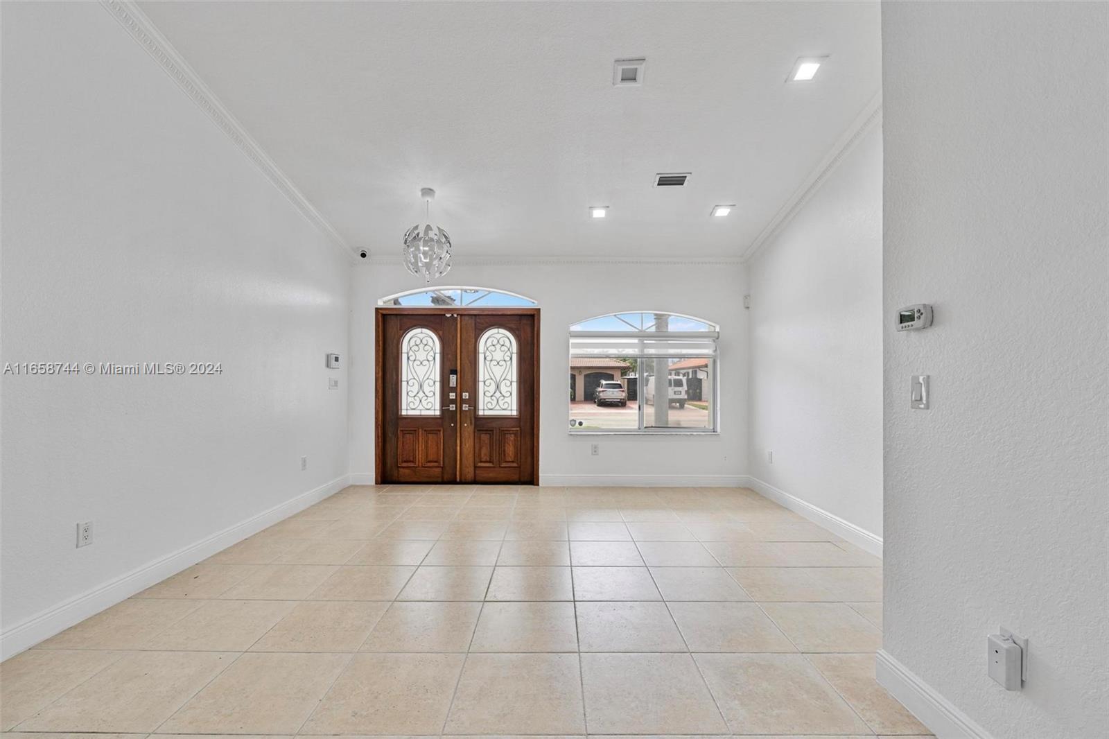 3209 Southwest 142nd Place Miami, FL 33175 - Photo 7 of 42 a view of an empty room with a window