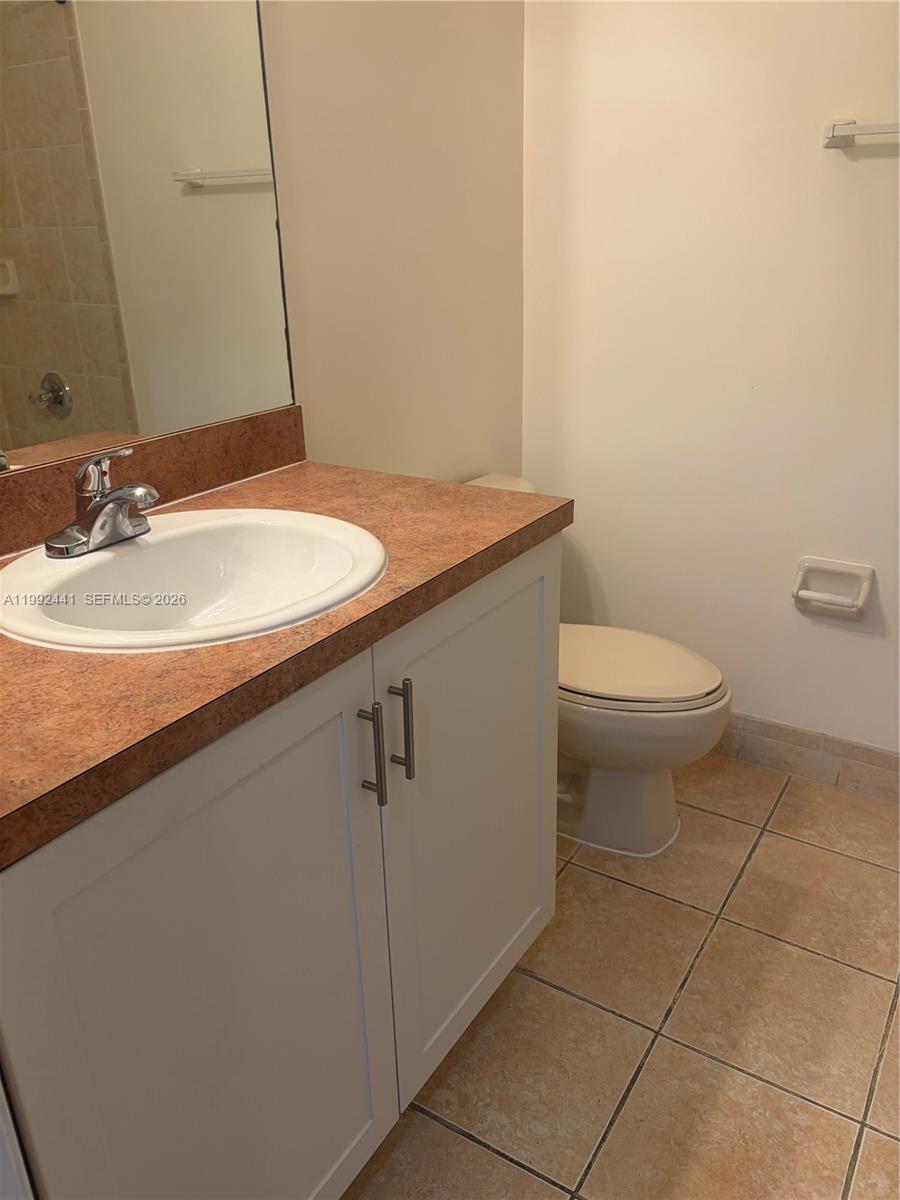 12398 Southwest 125th Terrace Miami, FL 33186 - Photo 34 of 45 a bathroom with a sink and a toilet