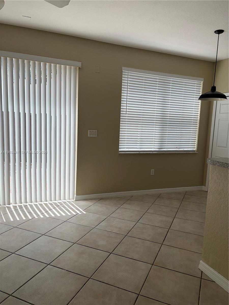 12398 Southwest 125th Terrace Miami, FL 33186 - Photo 8 of 45 an empty room with windows