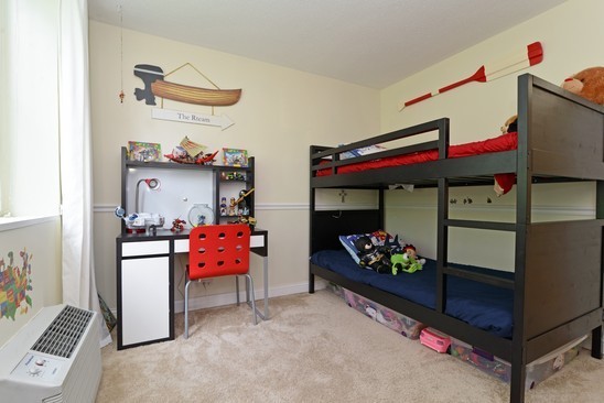 1339 North Dearborn Street, Unit 4H Chicago, IL 60610 - Photo 8 of 13 a kitchen with stainless steel appliances kitchen island granite countertop a table and chairs in it