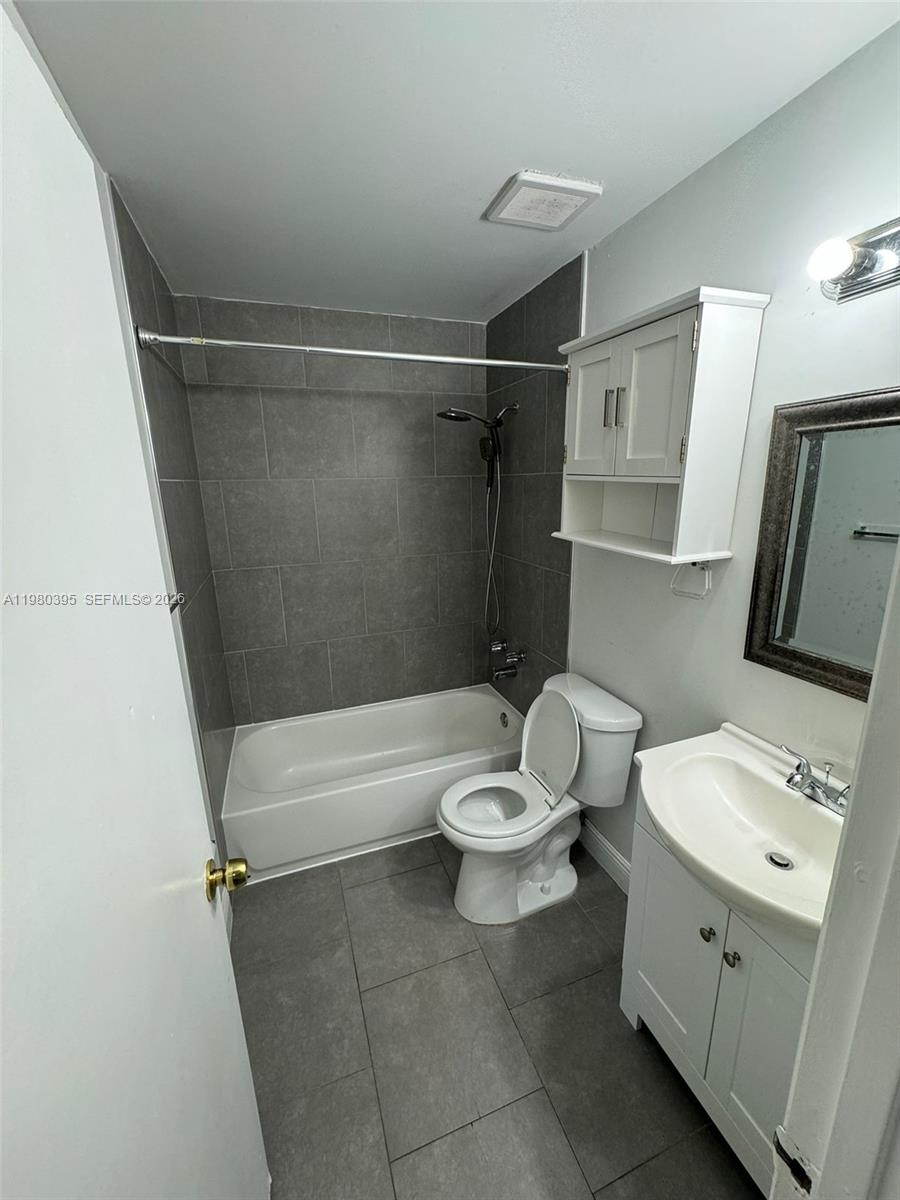 6235 Southwest Kendale Lakes Circle, Unit 237 Miami, FL 33183 - Photo 15 of 24 a bathroom with a sink toilet and shower
