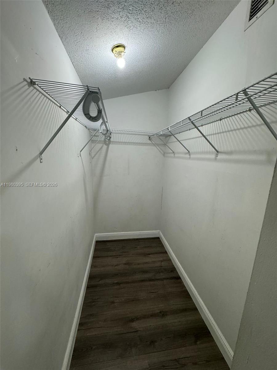 6235 Southwest Kendale Lakes Circle, Unit 237 Miami, FL 33183 - Photo 18 of 24 a view of a walk in closet