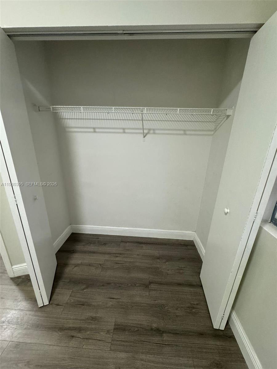 6235 Southwest Kendale Lakes Circle, Unit 237 Miami, FL 33183 - Photo 22 of 24 a view of an empty walk in closet