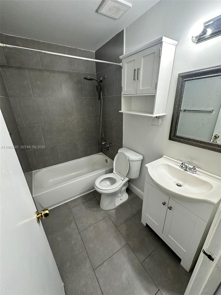 6235 Southwest Kendale Lakes Circle, Unit 237 Miami, FL 33183 - Photo 23 of 24 a bathroom with a sink a toilet and a shower