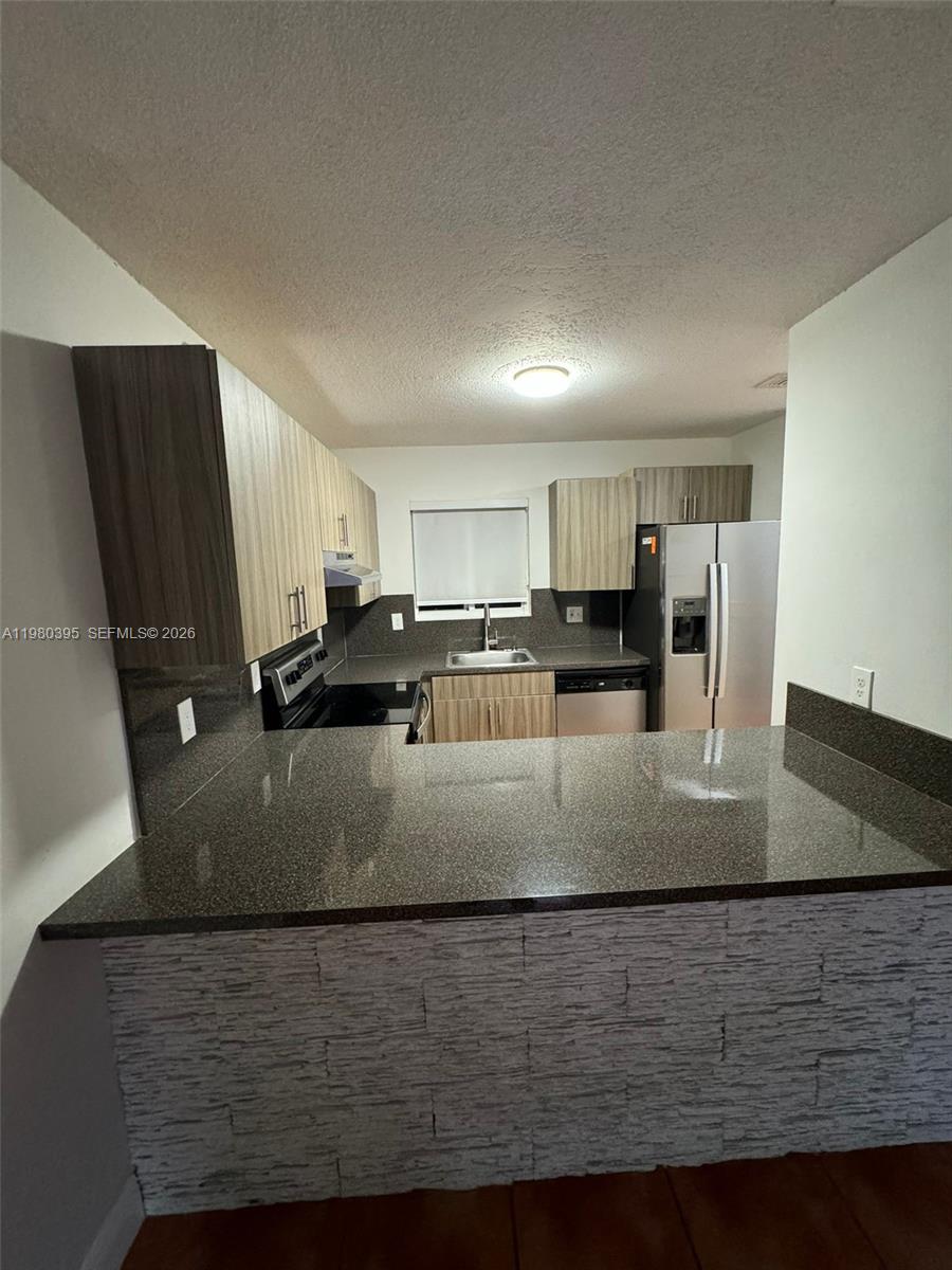 6235 Southwest Kendale Lakes Circle, Unit 237 Miami, FL 33183 - Photo 3 of 24 a view of a kitchen counter top space