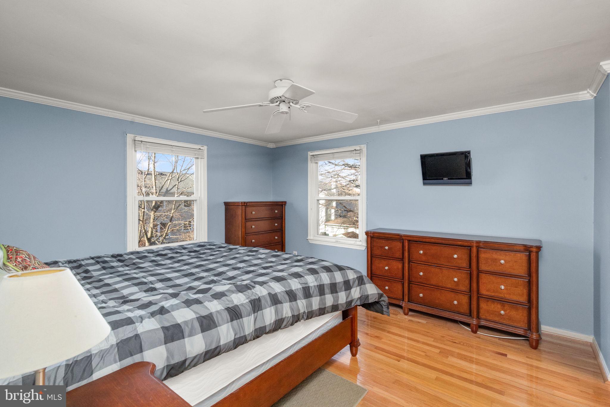 4802 Variation Road Nottingham, MD 21236 - Photo 14 of 32 a bedroom with a bed a dresser and wooden floor