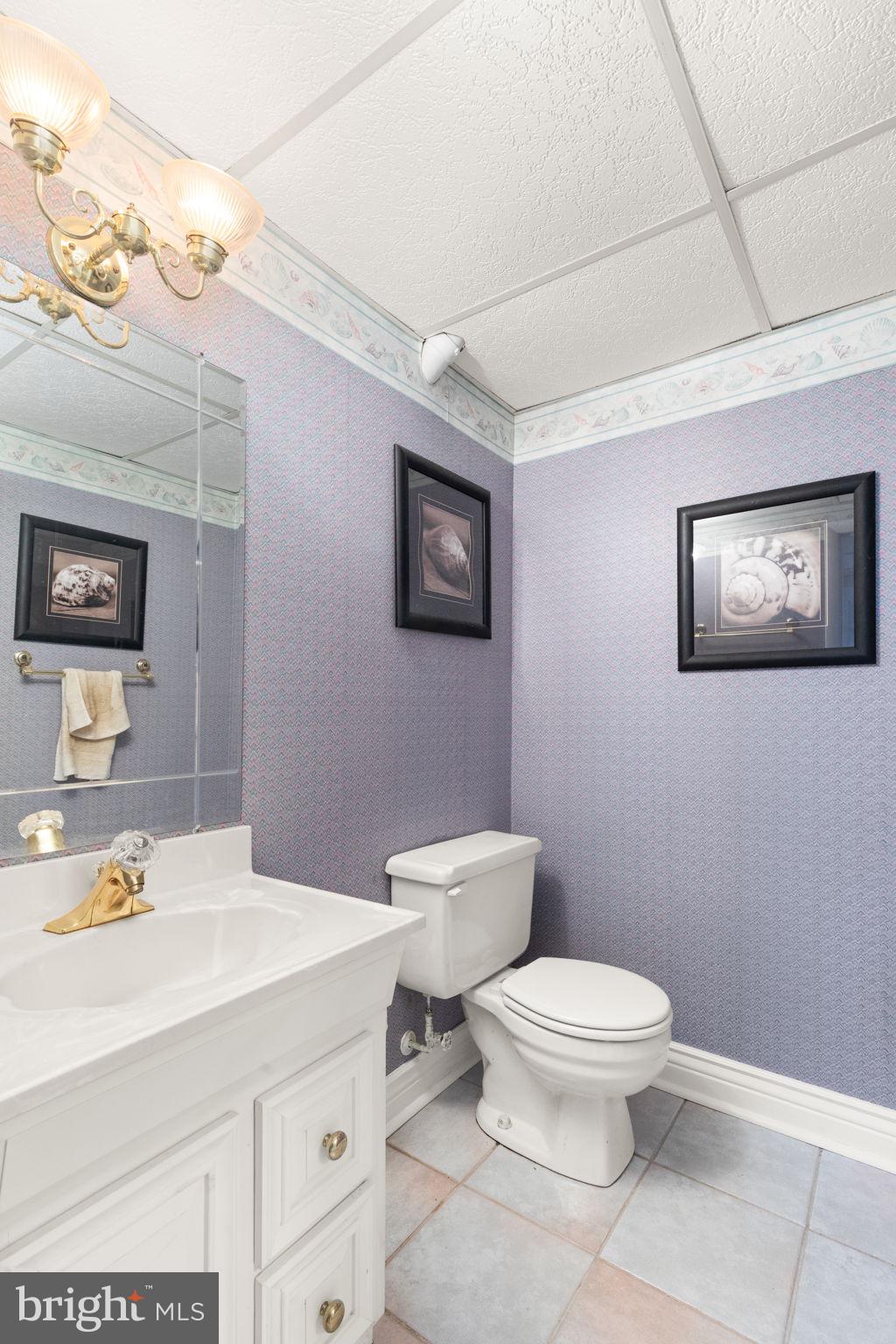 4802 Variation Road Nottingham, MD 21236 - Photo 26 of 32 a bathroom with a toilet sink and mirror