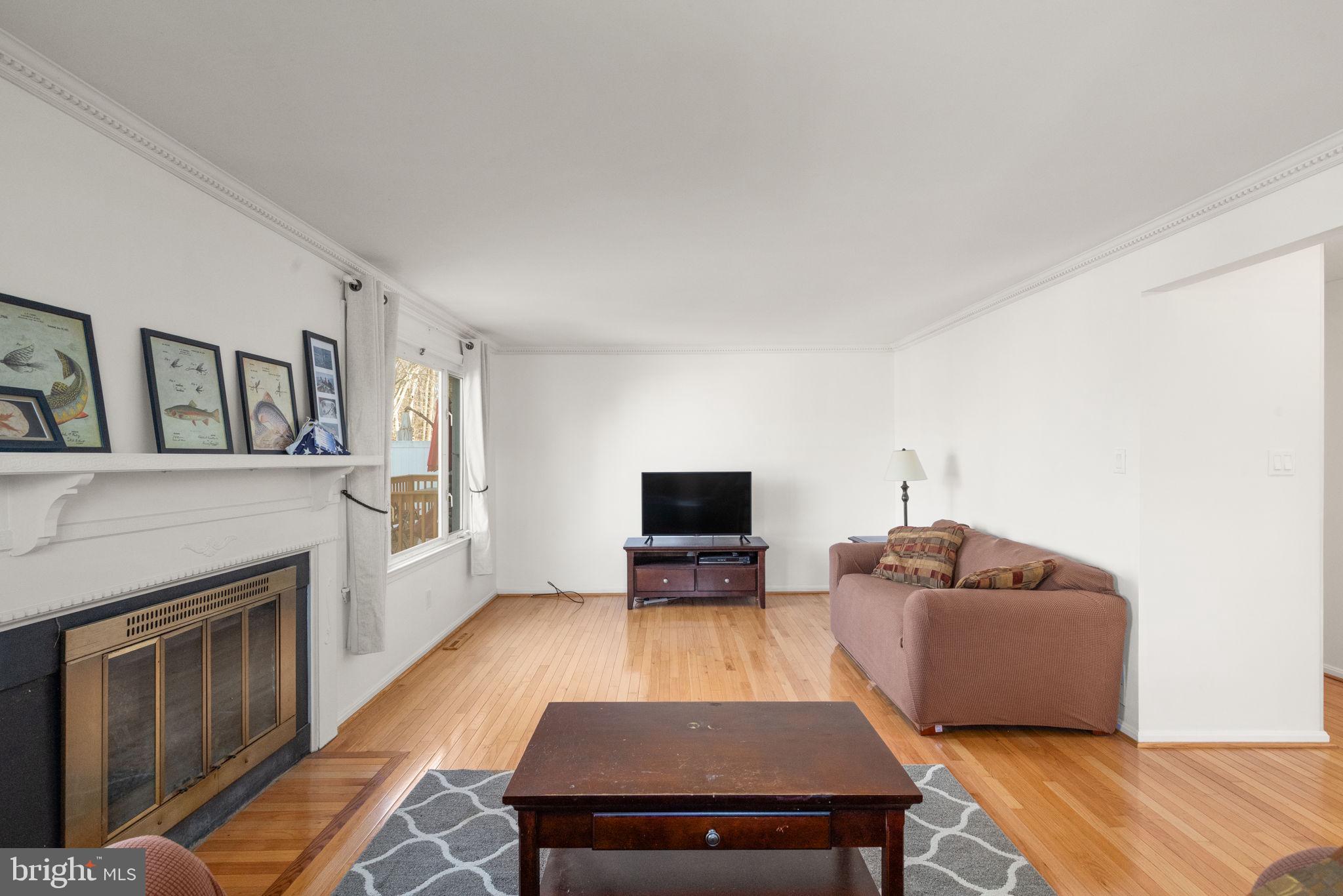 4802 Variation Road Nottingham, MD 21236 - Photo 5 of 32 a living room with furniture and a fireplace