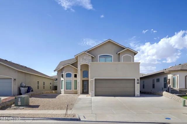 a view of a white house with a outdoor space